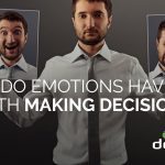 Man holding happy and sad emotion images to show connection of emotions and decision making